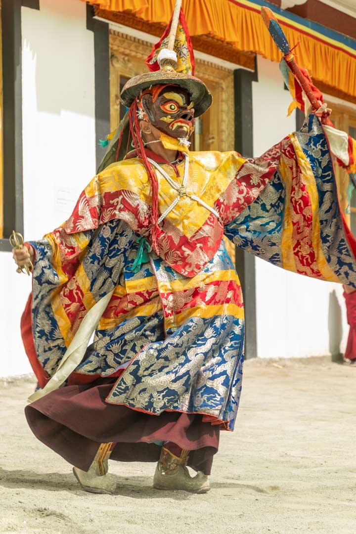 Masked figure in a cultural procession
