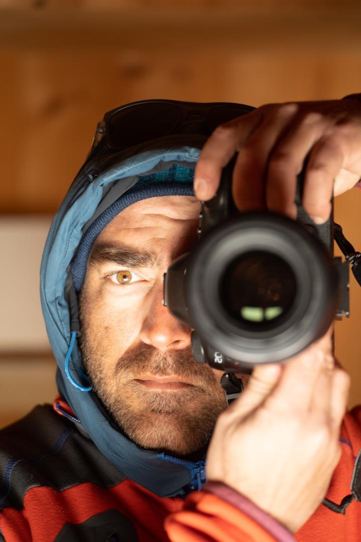 Roberto Cabrera looking through a camera