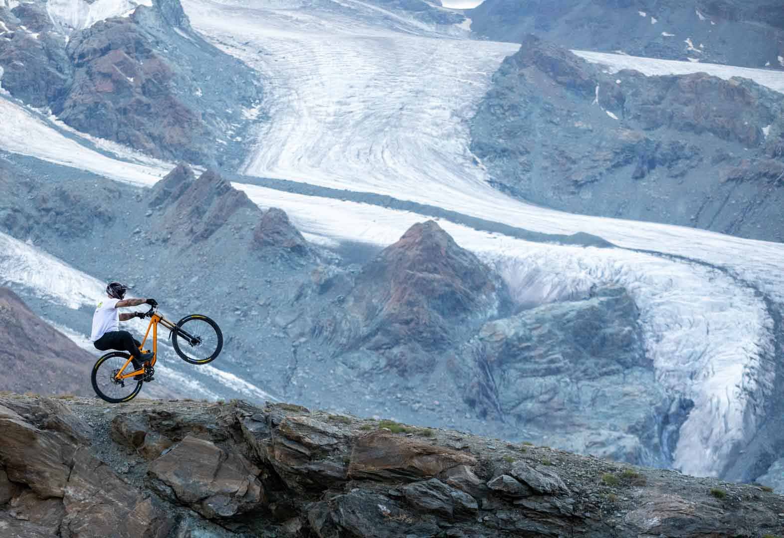 Enduro rider riding above a glacier