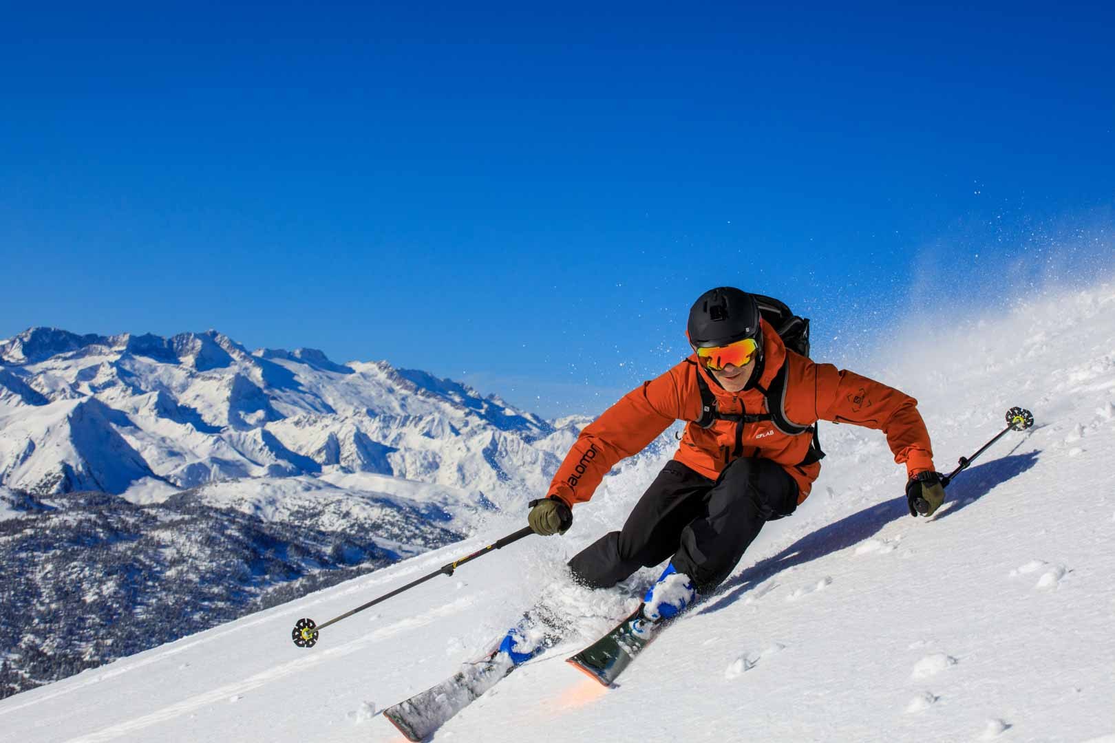 Freeride skier cutting a clean line through snow