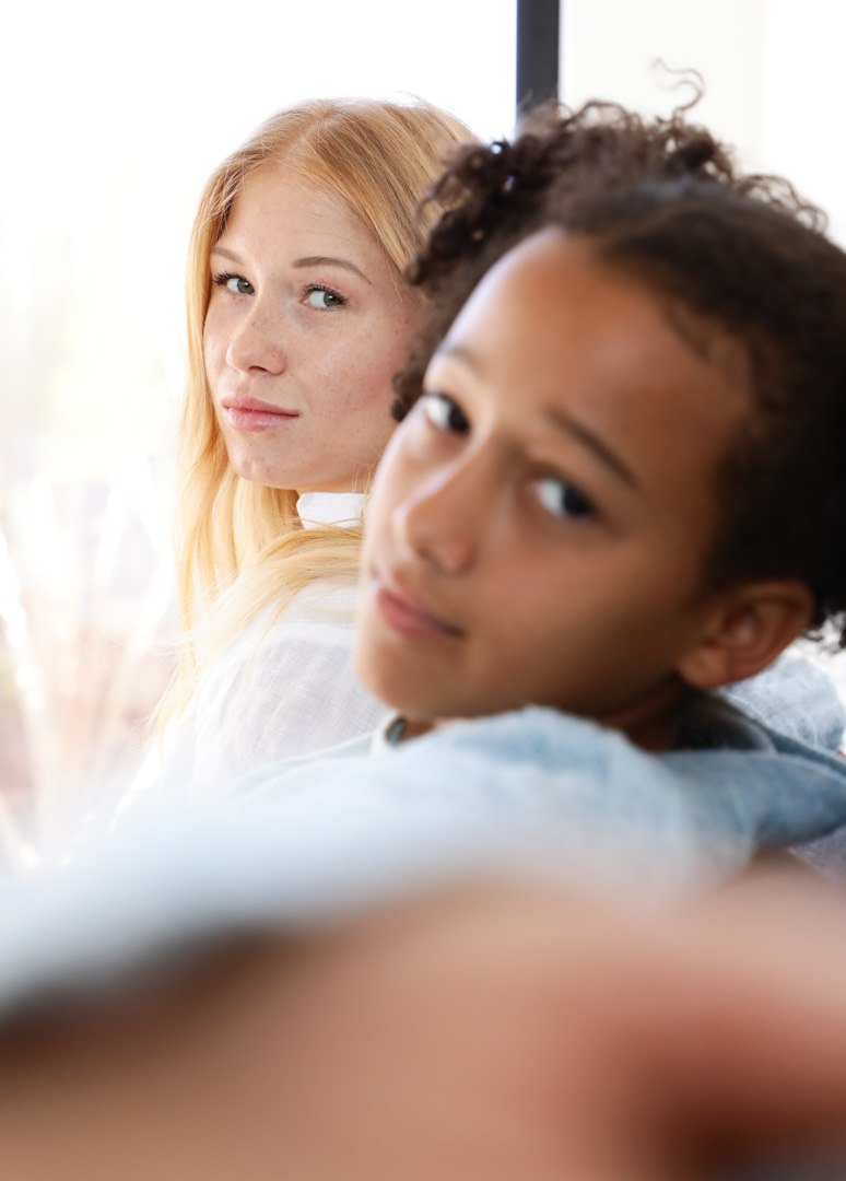 Two young people looking toward the camera