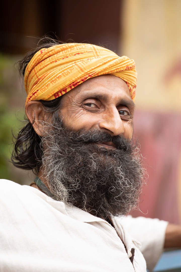 Portrait of a bearded man in a yellow turban